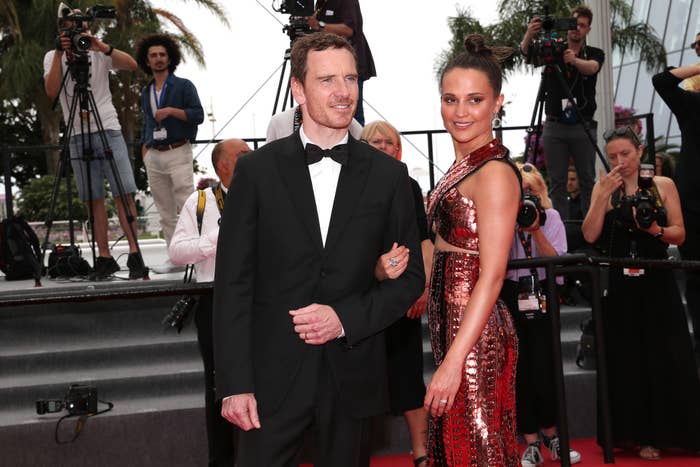 The couple arm-in-arm at a red carpet event