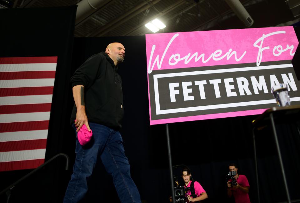 Democratic Pennsylvania Senate nominee John Fetterman arrives on stage for a rally with U.S. Congresswomen Madeleine Dean and Mary Gay Scanlon on September 11, 2022 at Montgomery County Community College in Blue Bell, Pennsylvania. In the November general election, Fetterman faces U.S. Senate candidate Dr. Mehmet Oz.