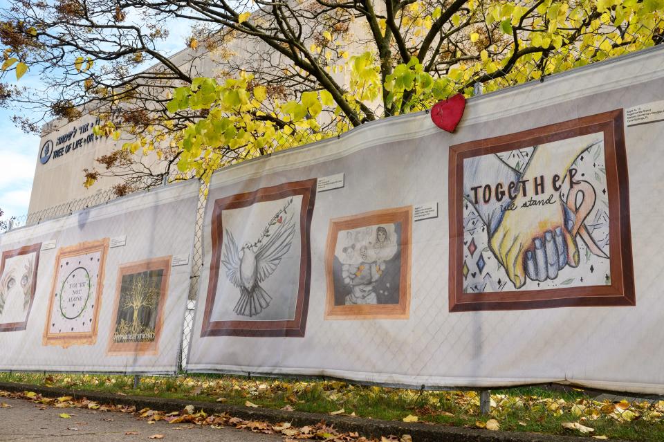 Artwork is displayed on the covering of a fence that surrounds the Tree of Life synagogue as the fifth anniversary of the October 2018 mass shooting approaches on Wednesday, Oct. 25, 2023, in Pittsburgh's Squirrel Hill neighborhood.