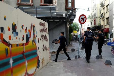 Riot police use rubber pellets to disperse LGBT rights activists during a transgender pride parade, which was banned by the governorship, in central Istanbul, Turkey, June 19, 2016. REUTERS/Osman Orsal