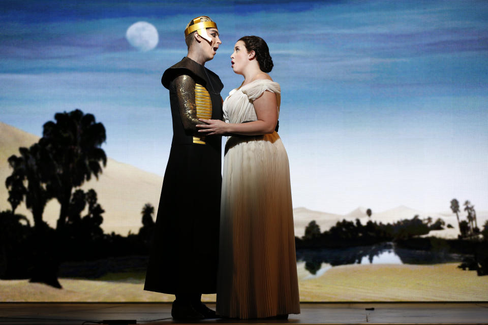 In this April 12, 2013 photo provided by the New York City Opera, tenor Randall Bills, as Pharaoh's son, Osiride, performs with soprano Sian Davies as Elcia during the New York City Opera's final dress rehearsal of Rossini's rarely performed "Mose in Egitto (Moses in Egypt)," at the City Center in New York. (AP Photo/New York City Opera, Carol Rosegg)