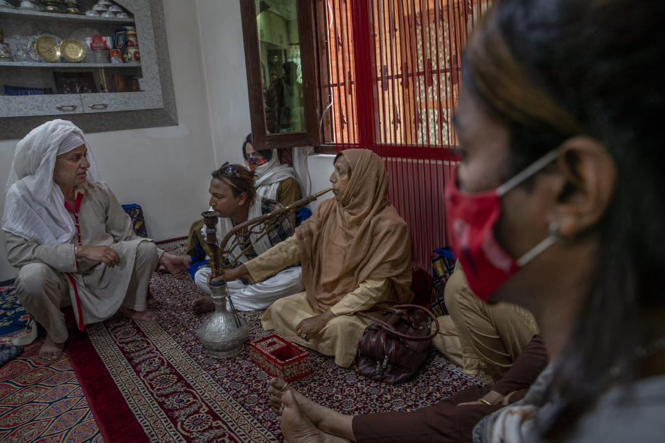 Transgender Kashmiris interact during a special meet of their community members in Srinagar, Indian controlled Kashmir, Thursday, June 3, 2021. Many of Kashmir's transgender people face domestic abuse and end up running away from families at an early age. Some lack housing, education and other basic resources. Living in the shadows of conflict, coupled with the recent crisis of the pandemic, has pushed the community further to the margins. (AP Photo/ Dar Yasin)