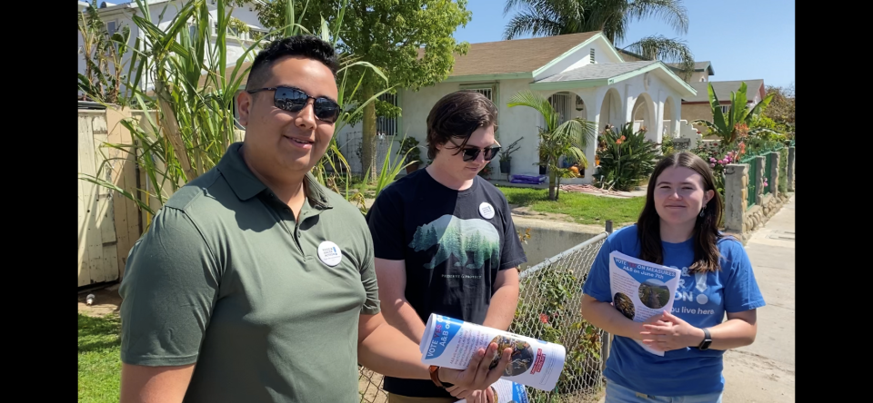 Measure A and B supporters Nathan Castillo, from left, Eric Burschinger and Jillian Hall canvassed homes in Oxnard in April to turn out the vote.