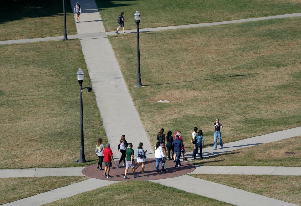 Students cross the South Oval while taking a tour of the Ohio State University campus in Columbus.