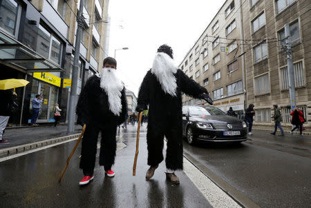 Demonstrators dressed in costumes take part in an anti-corruption rally demanding the resignation of the interior minister and police chief in Bratislava, Slovakia, April 18, 2017. REUTERS/David W Cerny