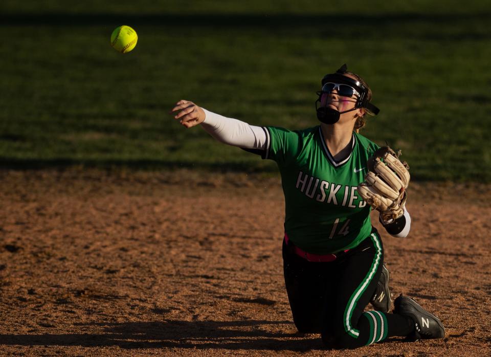 North's Hannah Wilke throws from her knees to try to get the Boonville batter out at Mike Wilson Field Tuesday evening, March 28, 2023.