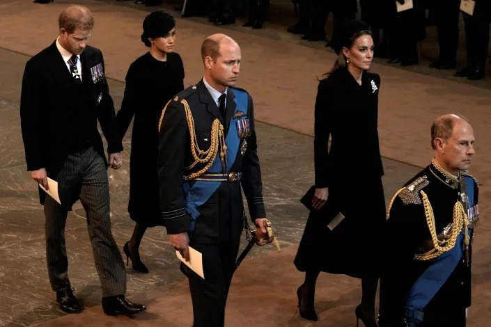 Prince Harry and Meghan Markle held hands at a service honoring the Queen on Wednesday.