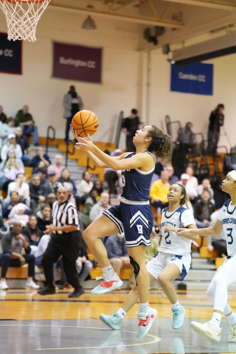 Morris Catholic vs. Randolph in the Morris County Tournament Girls Basketball Semifinals at the County College of Morris on Friday, February 10, 2023. R #23 Sydney Jenisch drives to the basket. 