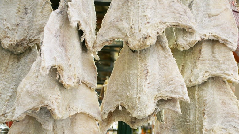 Salted cod hanging in market