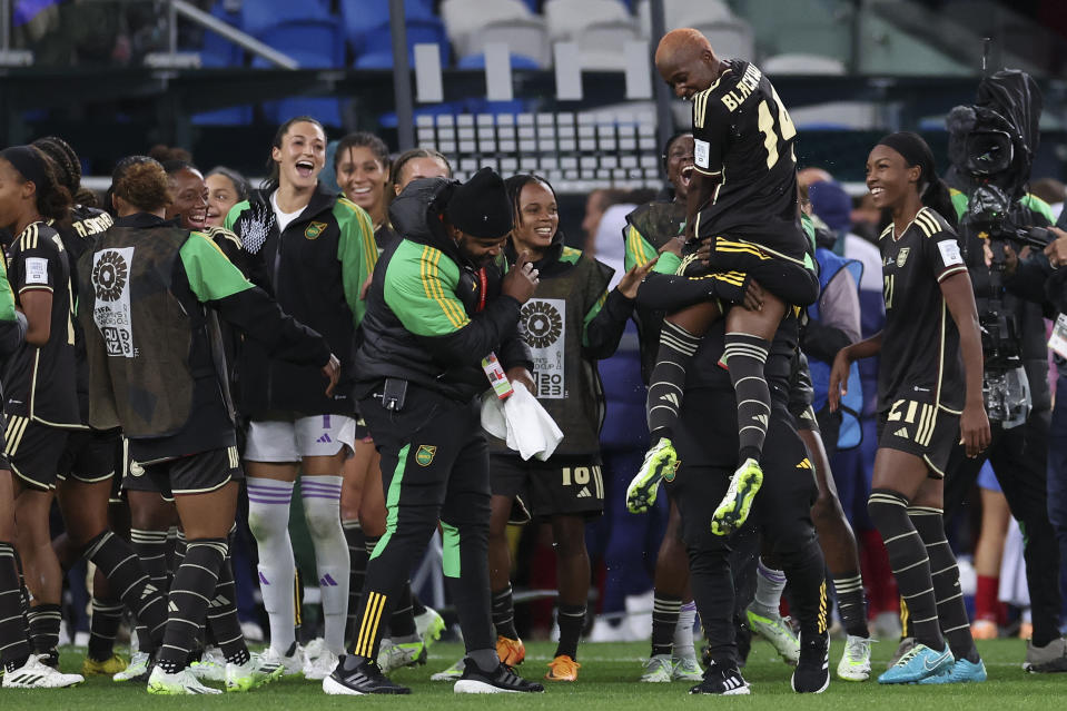Jamaica's Deneisha Blackwood is lifted after playing in a 0-0 draw during the Women's World Cup Group F soccer match between France and Jamaica at Sydney Football Stadium in Sydney, Australia, Sunday, July 23, 2023. (AP Photo/Sophie Ralph)