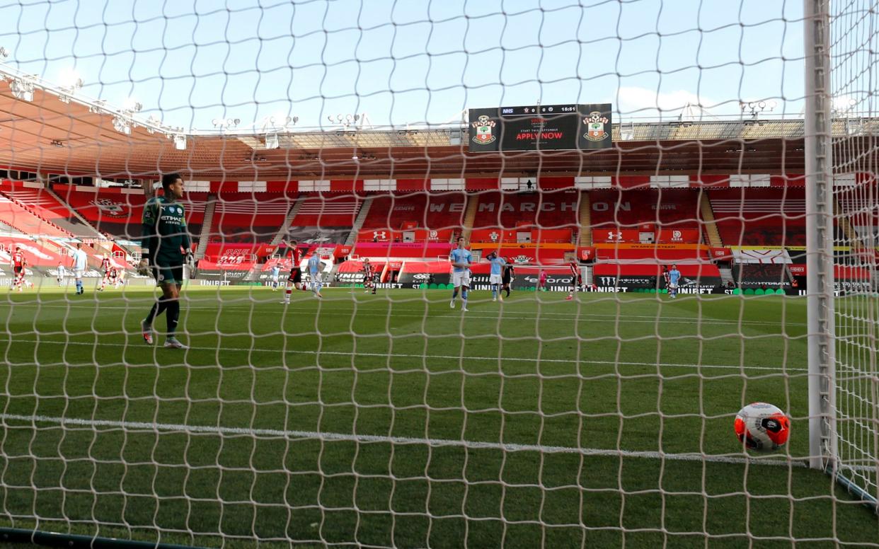 Ederson looks on after being lobbed from 40 yards out - AP