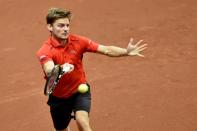 Belgium's David Goffin returns the ball to Britain's Andy Murray during their tennis match on the third day of the Davis Cup final between Belgium and Britain at Flanders Expo in Ghent on November 29, 2015
