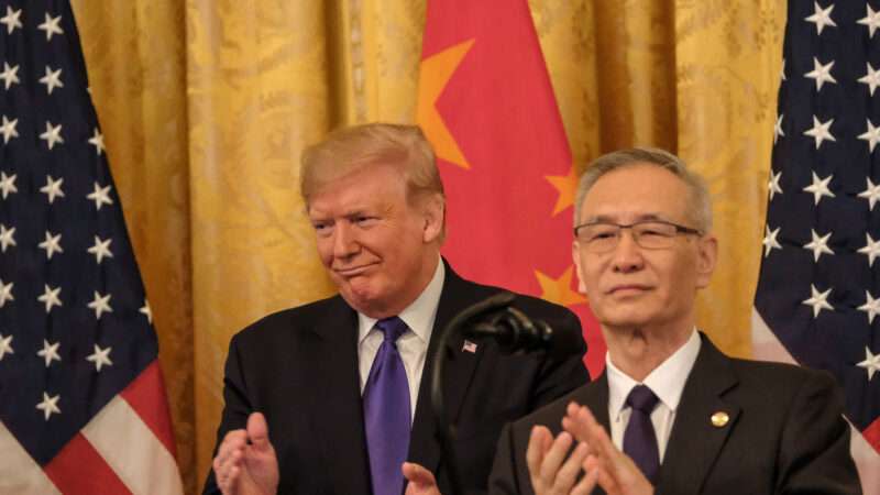 Donald Trump in front of Chinese flag