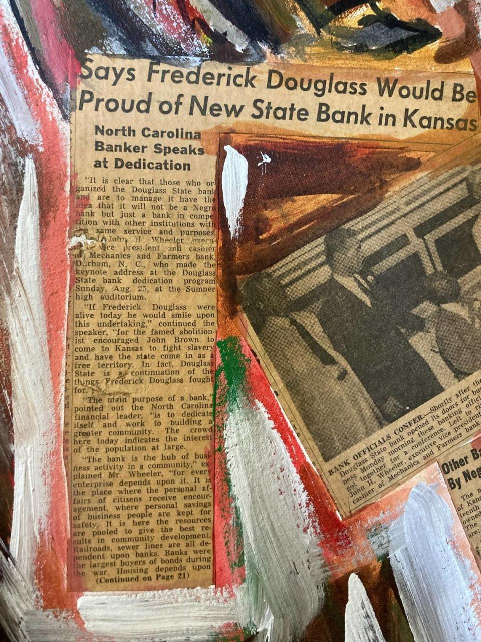 A news story embedded into the 1974 mural painted by Hank Smith says Douglass State Bank, the first Black-owned bank in Kansas, evoked the spirit of Frederick Douglass.