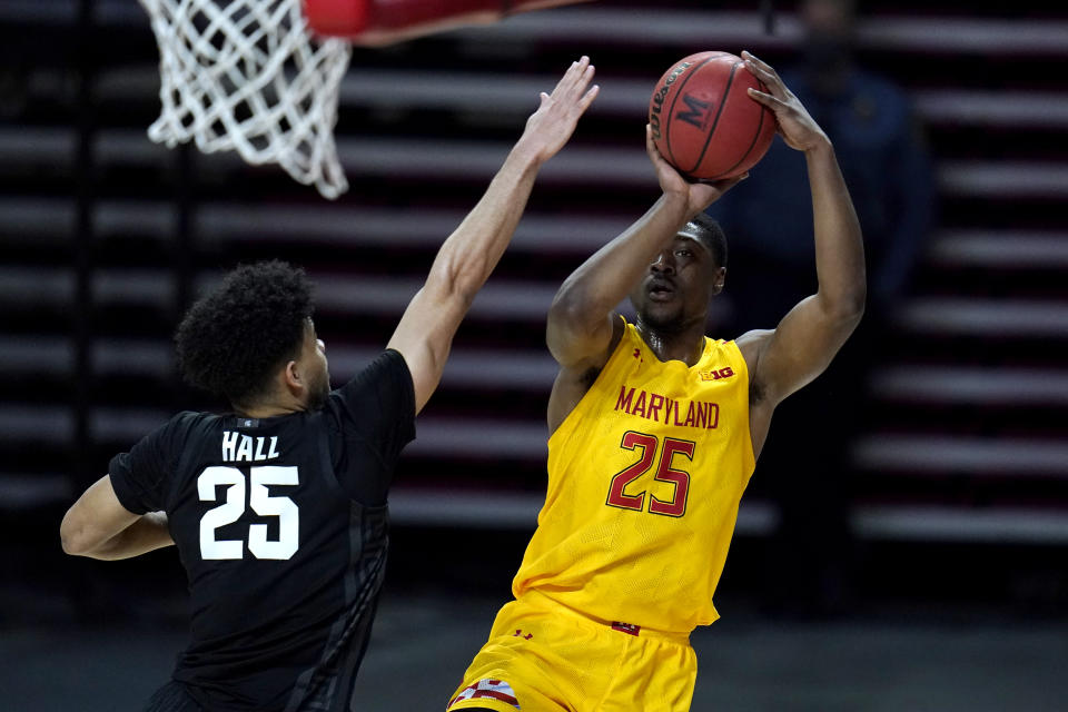 Maryland forward Jairus Hamilton, right, shoots against Michigan State forward Malik Hall during the second half of an NCAA college basketball game, Sunday, Feb. 28, 2021, in College Park, Md. Maryland won 73-55. (AP Photo/Julio Cortez)