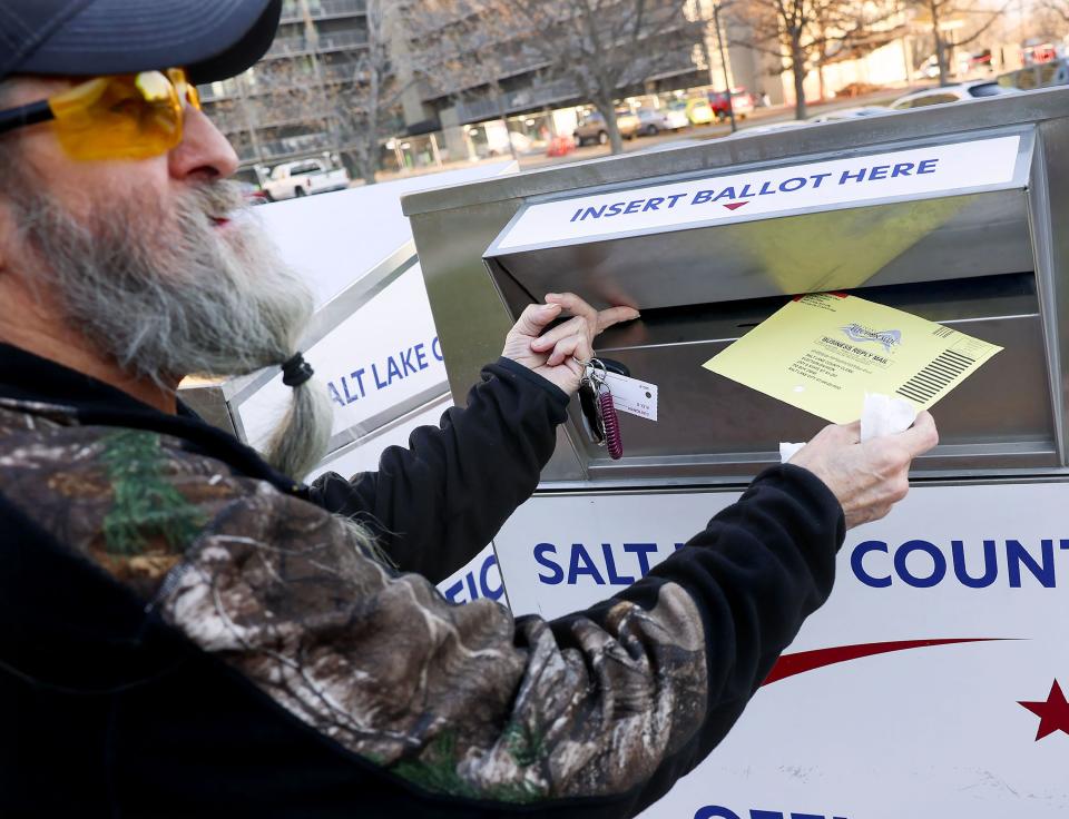 Jimi Vallejo places his ballot into a secure ballot drop box at the Salt Lake County Government Center in Salt Lake City on Wednesday, Nov. 21, 2023. | Laura Seitz, Deseret News