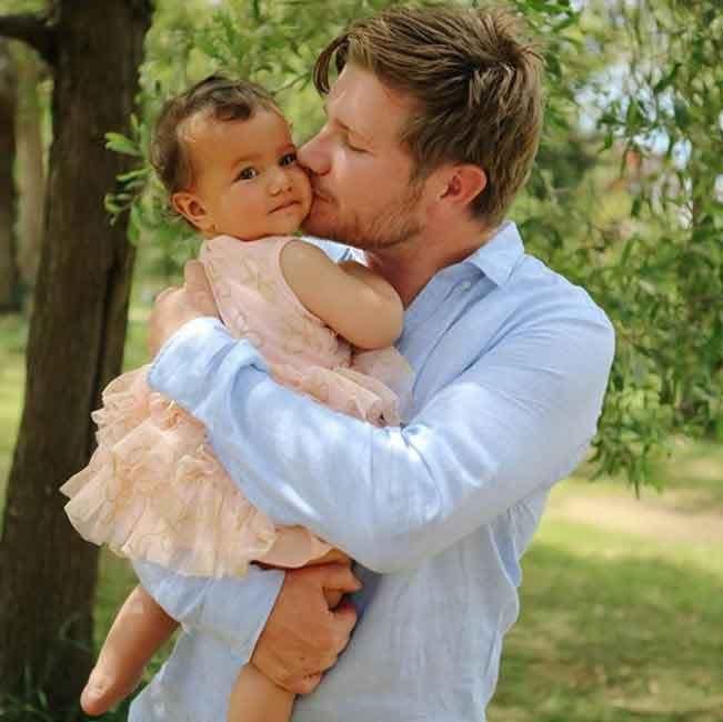 Alex snuggled up to his one-year-old daughter in this sweet snap. Source: Asiya & Maye Photography