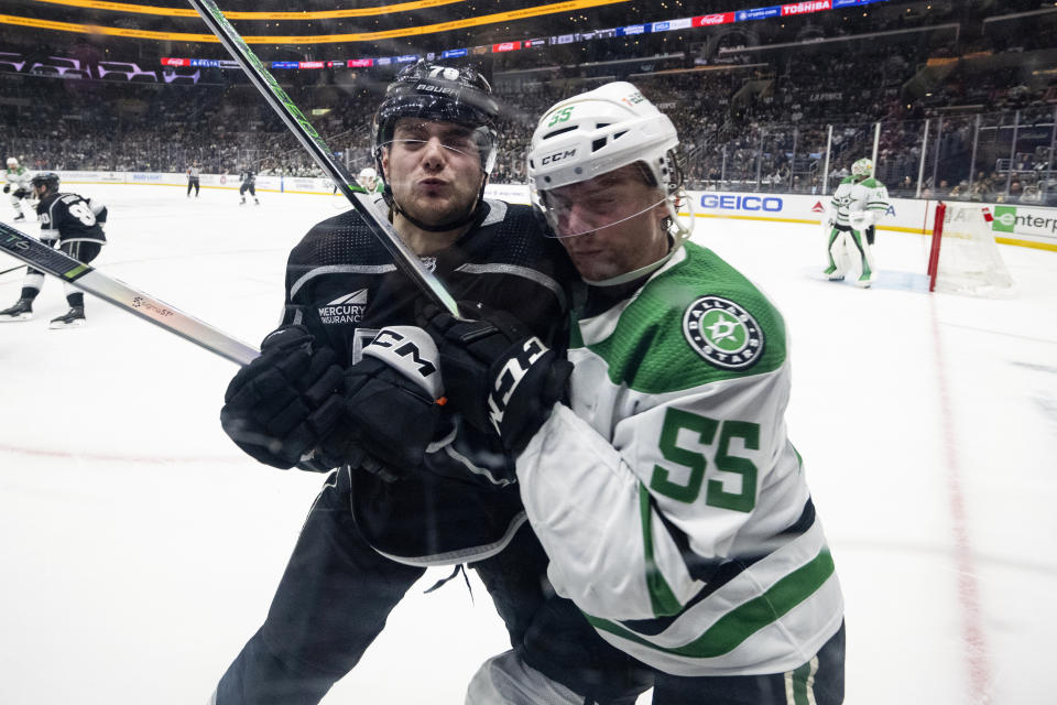 Los Angeles Kings right wing Alex Laferriere (78) checks Dallas Stars defenseman Thomas Harley (55) during the second period of an NHL hockey game, Saturday, March 9, 2024, in Los Angeles. (AP Photo/Kyusung Gong)