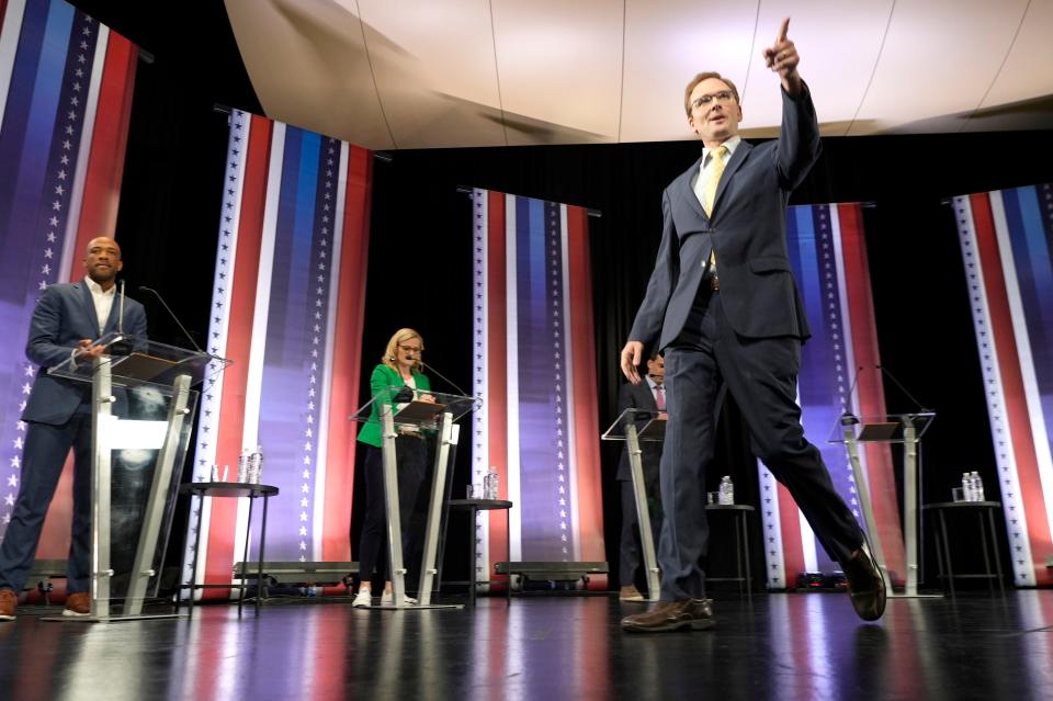 Outagamie County Executive Tom Nelson enters the stage during the Democratic U.S. Senate debate at Marquette University's Varsity Theatre in Milwaukee on Sunday, July 17, 2022. It was the first televised debate of Wisconsin's campaign season before the Aug. 9 primary.