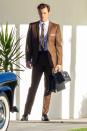 <p>Harry Styles cuts a handsome figure in a retro ensemble on the set of <i>Don’t Worry Darling </i>in Palm Springs on Tuesday. </p>