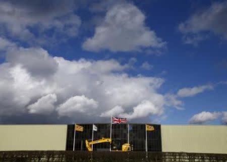 A Union flag flies at the JCB factory in Uttoxeter, central England, March 3, 2015. Picture taken March 3, 2015. REUTERS/Darren Staples