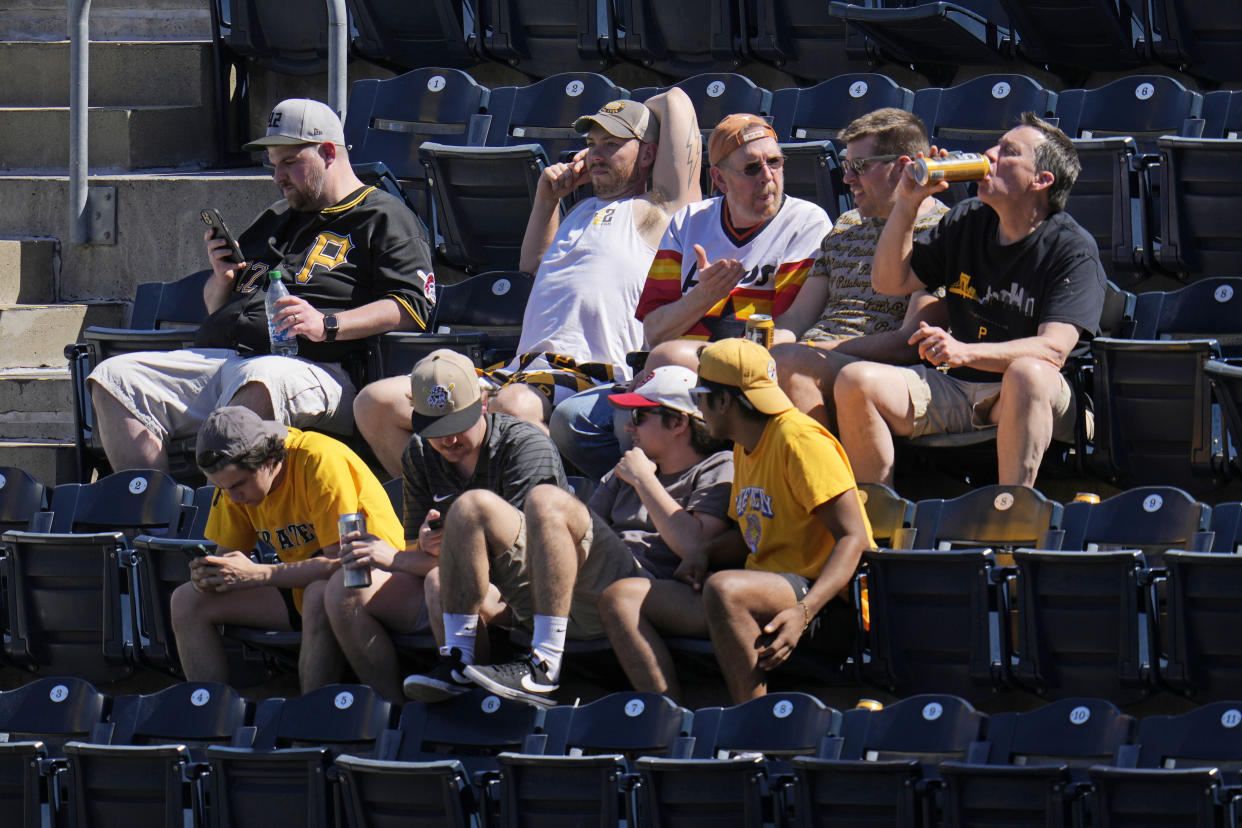 Baseball fans at PNC Park watch a baseball game between the Pittsburgh Pirates and the Houston Astros in Pittsburgh, Wednesday, April 12, 2023. (AP Photo/Gene J. Puskar)