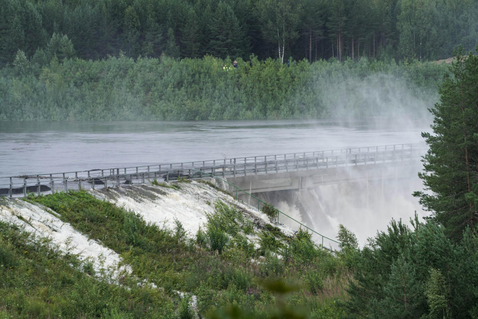 The Braskreidfoss Power plant is pictured in Braskereidfoss, Norway, Wednesday, Aug. 9, 2023. Authorities in Norway are considering blowing up a dam at risk of bursting after days of heavy rain to prevent downstream communities from getting deluged. The Glama, Norway’s longest and most voluminous river, is dammed at the the Braskereidfoss hydroelectric power plant, which was under water and out of operation on Wednesday. (Cornelius Poppe/NTB Scanpix via AP)