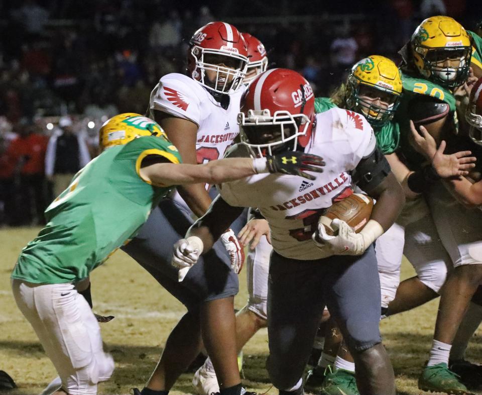 Jacksonville's Damon June scored three touchdowns Friday night in a 27-21 overtime win at Eastern Alamance. 