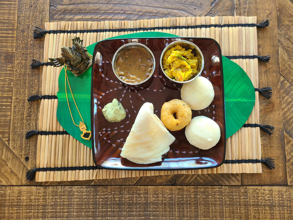 Dosa, idlis and a vada with chutney, sambar and masala. (Courtesy Laya Neelakandan)