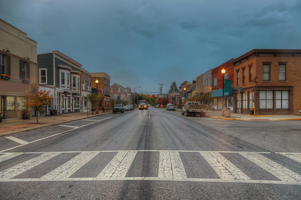 a crosswalk in the middle of a small downtown center