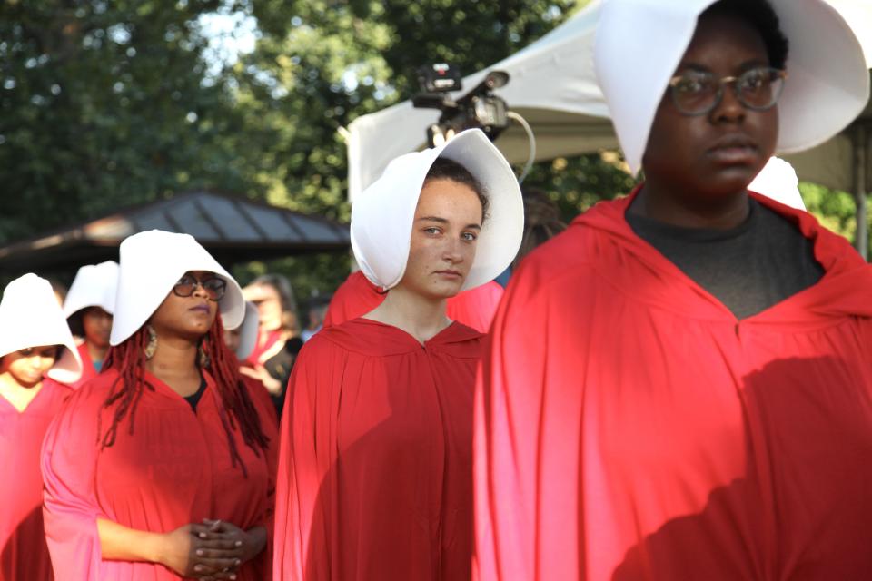 Margot Bloch (center) dressed as a Handmaid on Sept. 4, 2018 (Photo: Photograph by Liz Gorman)