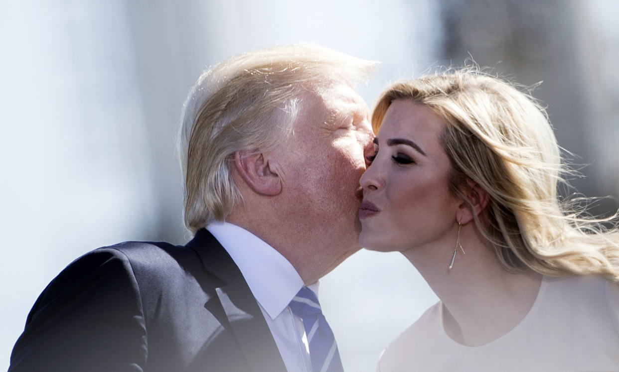 President Trump kisses his daughter Ivanka during a tax-reform rally in Mandan, N.D., on Sept. 6. (Photo: Brendan Smialowski/AFP/Getty Images)