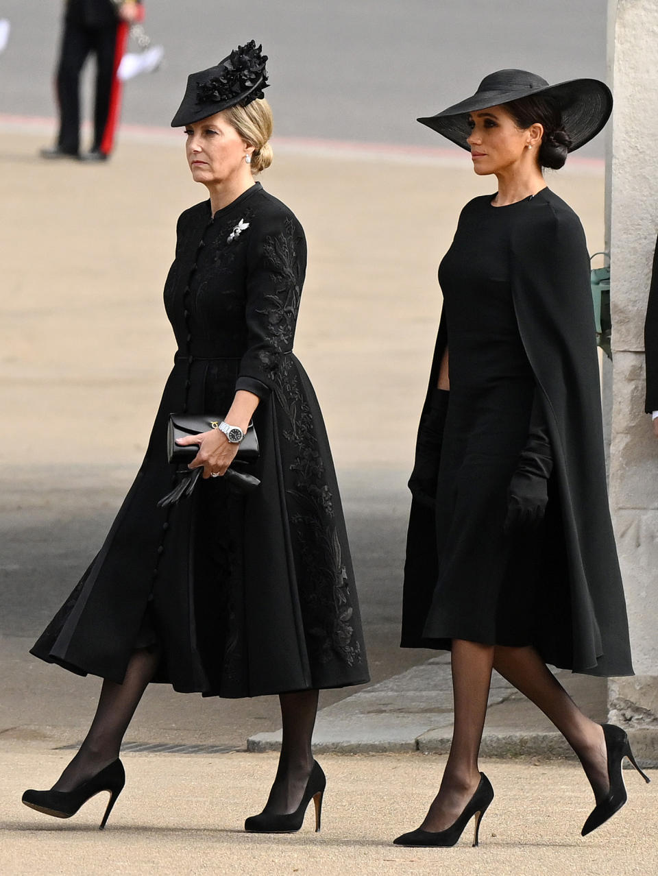 The Duchess cut a striking figure in a high-fashion caped dress, complete with wide-brimmed hat. (Getty Images)