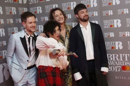 Ross McDonald, Matt Healy, George Daniel and Adam Hann of The 1975 pose with their award for Best British Group at the Brit Awards at the O2 Arena in London, Britain, February 22, 2017. REUTERS/Neil Hall