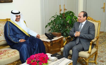 Egyptian President Abdel Fattah al-Sisi (R) speaks with Kuwait's Foreign Minister Sabah Al-Khalid al-Sabah in Cairo, Egypt, July 17, 2017. Egyptian Presidency/Handout via REUTERS