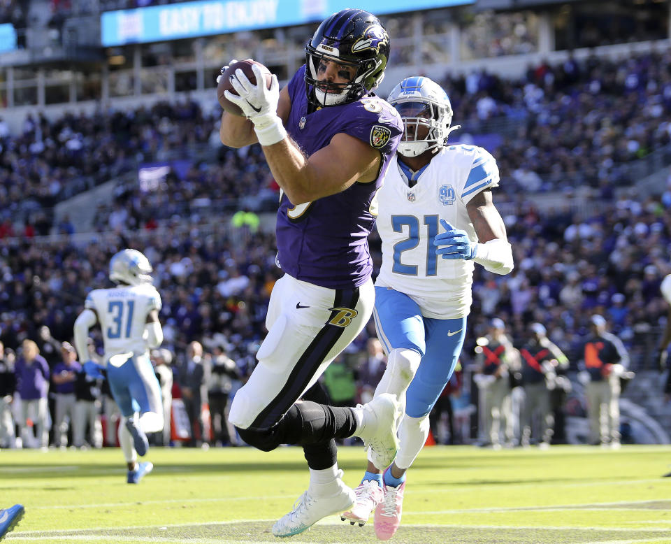 FILE - Baltimore Ravens tight end Mark Andrews (89) catches a touchdown pass during an NFL football game against the Detroit Lions, Oct. 22, 2023, in Baltimore. Andrews is back at practice for the Ravens after missing the final six games of the regular season because of an ankle injury. (AP Photo/Daniel Kucin Jr., File)