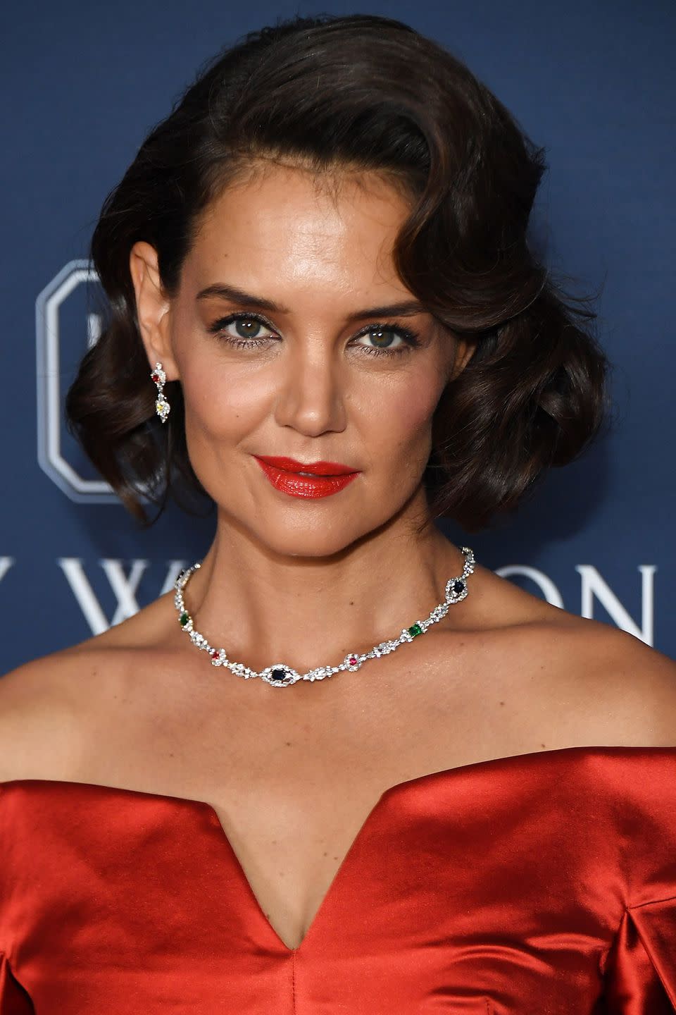 <p>Katie Holmes' glamorous 1950s-inspired curls are the perfect inspiration for your next black-tie event. Recreate them by bending large sections of your hair over a wide-barrelled curling wand, like Babyliss' <a rel="noopener" href="https://fave.co/2PWCbrr" target="_blank" data-ylk="slk:Soft Waves Wand;elm:context_link;itc:0;sec:content-canvas" class="link ">Soft Waves Wand</a> to achieve an 'S' shaped wave. Then, spritz on Redken's <a rel="noopener" href="https://fave.co/2OJmP9d" target="_blank" data-ylk="slk:Control Addict Hairspray;elm:context_link;itc:0;sec:content-canvas" class="link ">Control Addict Hairspray</a> from beneath your curls to add hold without weighing them down - and if you have long hair, use Hersheson's <a rel="nofollow noopener" href="https://www.hershesons.com/black-grips-disabled.html?gclid=CjwKCAjwspHaBRBFEiwA0eM3kUGTQUuXqd8T-9qizWr2WWrz1Hp7LZtZrGMmz0U7J3xsaz0A1xZ8EhoC5KEQAvD_BwE" target="_blank" data-ylk="slk:'Get A Grip' Grips;elm:context_link;itc:0;sec:content-canvas" class="link ">'Get A Grip' Grips</a> to pin them up. Then, team with a bright red lipstick like Giorgio Armani's <a rel="noopener" href="https://fave.co/2PPwSKe" target="_blank" data-ylk="slk:Ecstasy Shine Lipstick in Scarletto;elm:context_link;itc:0;sec:content-canvas" class="link ">Ecstasy Shine Lipstick in Scarletto</a>.</p>