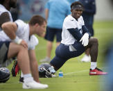 CORRECTS TO JUNE 10, 2021, NOT MAY 27, 2021, AS ORIGINALLY SENT - Tennessee Titans wide receiver Julio Jones, right, stretches during NFL football practice Thursday, June 10, 2021, in Nashville, Tenn. (George Walker IV/Pool Photo via AP)