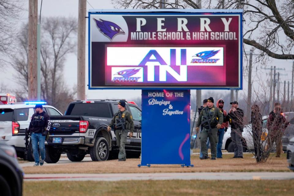 PHOTO: Police respond to Perry High School in Perry, Iowa., Jan. 4, 2024. (Andrew Harnik/AP)