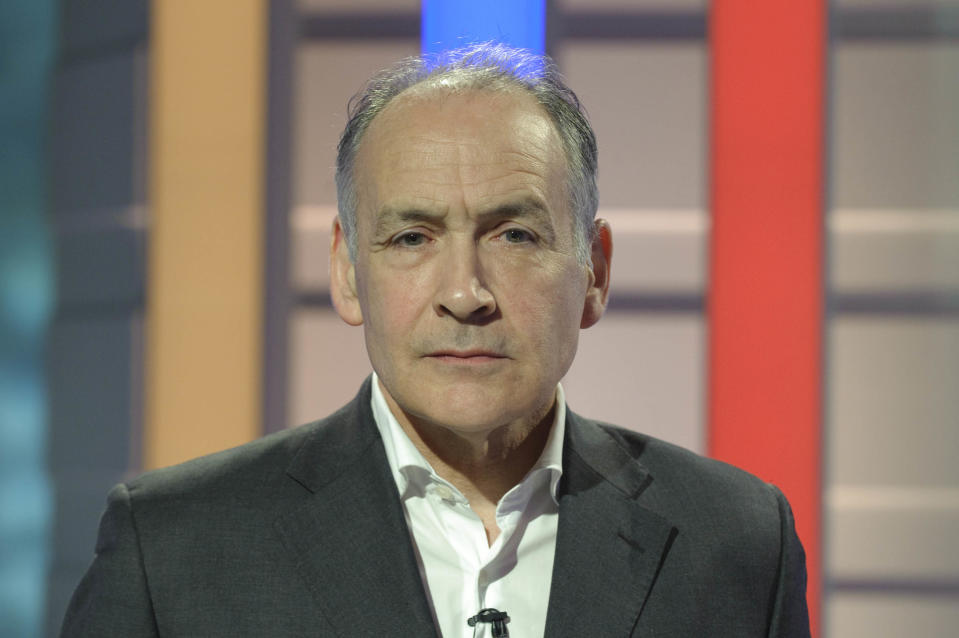 MANCHESTER, ENGLAND - APRIL 14:  In this handout image provided by ITV1, British journalist and newscaster Alastair Stewart looks on as the stage is prepared for the first televised general election debate between Gordon Brown, David Cameron and Nick Clegg for the United Kingdom's Prime Minister at ITV1 North West base studios on April 14, 2010 in Manchester, England. Britain for the first time is televising three political debates live, reminiscent of the U.S. style of debates. Alastair Stewart will moderate the first election debate, themed on domestic affair, airs April 15, 2010 live on ITV1 from 8.30 pm to 10.00 pm.   (Photo by Rob Evans/ITV via Getty Images)