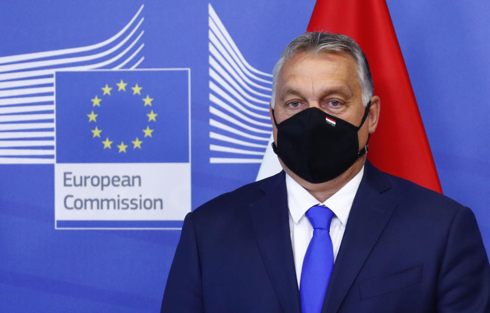 Hungary's Prime Minister Viktor Orban poses for a photographer prior to a meeting with European Commission President Ursula von der Leyen and the Visegrad Group at EU headquarters in Brussels, Thursday, Sept 24, 2020. (Francois Lenoir, Pool via AP)