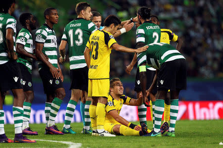 Football Soccer - Sporting Lisbon v Borussia Dortmund - Champions League - Group F - Alvalade stadium, Lisbon, Portugal - 18/10/16 Borussia Dortmund's Felix Passlack reacts on the ground. REUTERS/Pedro Nunes