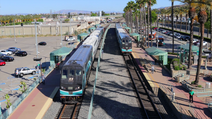 Two Metrolink trains depart a station in opposite directions in this undated photo from Metrolink.