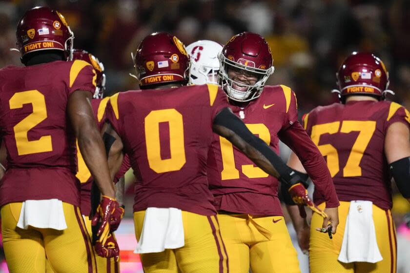 USC running back MarShawn Lloyd embraces quarterback Caleb Williams after scoring a touchdown against Stanford