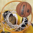 Tennessee's Josh Richardson looks up at a ball during the first half of an NCAA Midwest Regional semifinal college basketball tournament game against the Michigan Friday, March 28, 2014, in Indianapolis. (AP Photo/Michael Conroy)