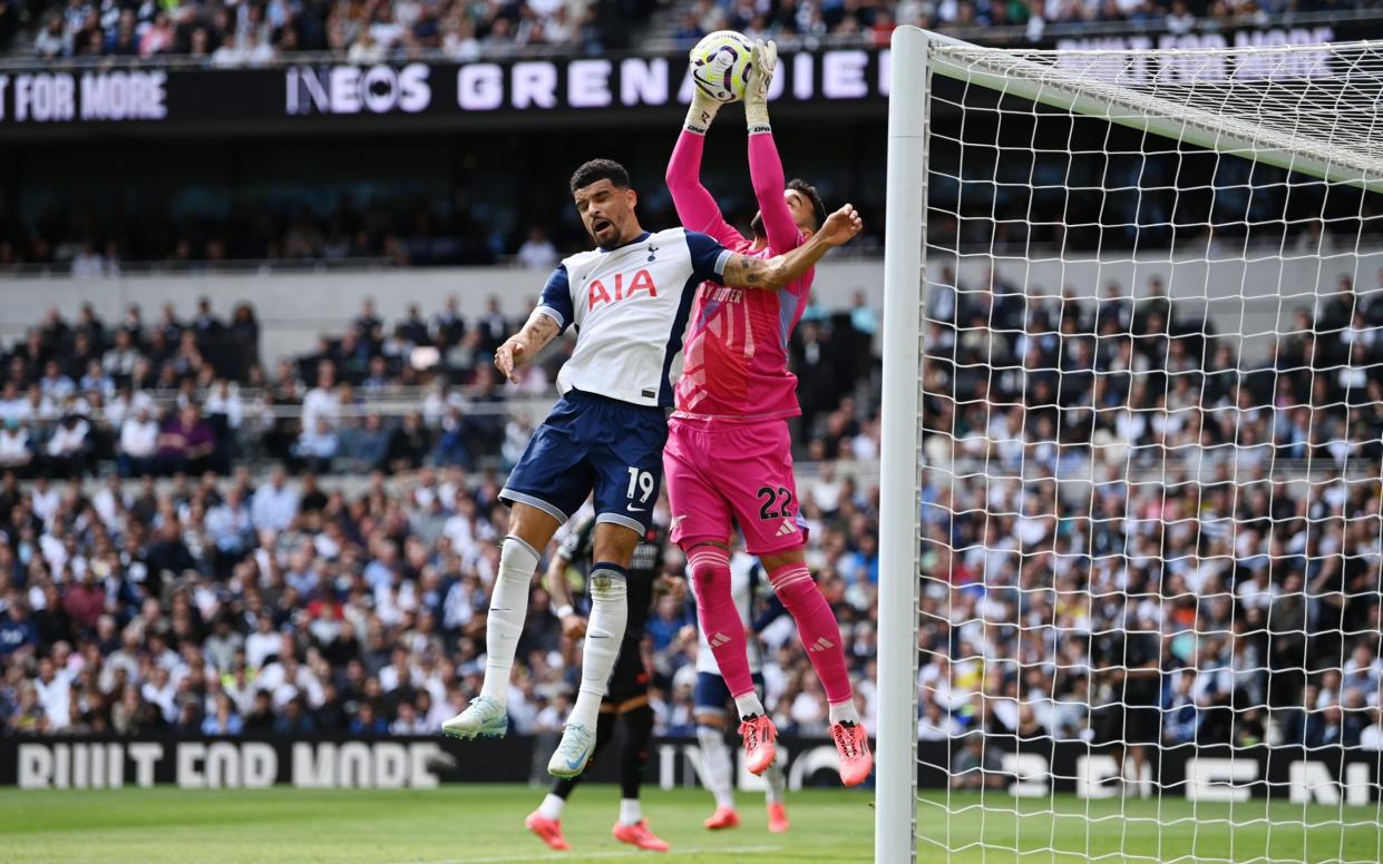 David Raya attempts to catch the ball under pressure from Dominic Solanke