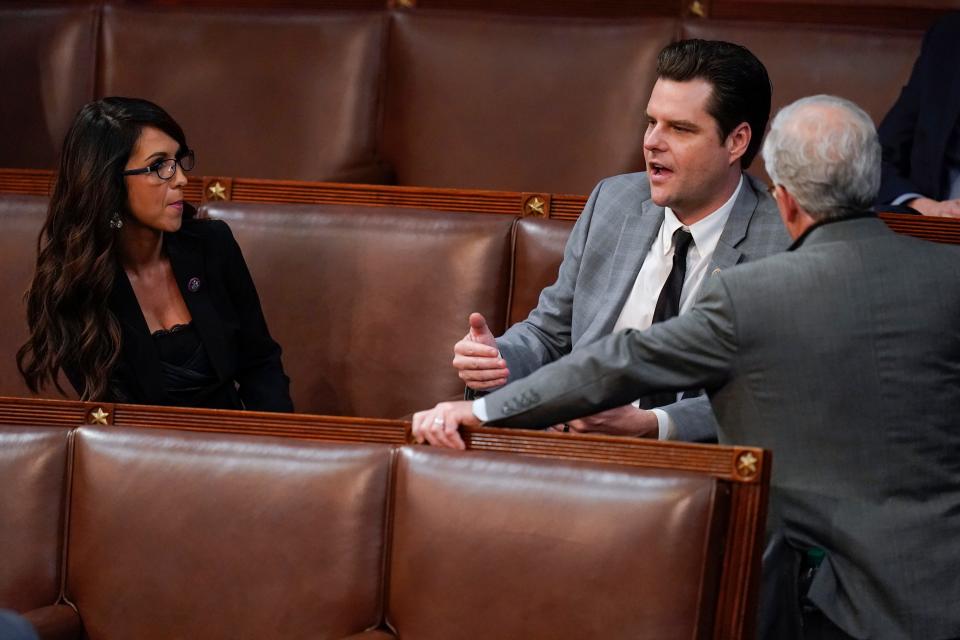 Rep. Lauren Boebert, R-Colo., and Rep. Matt Gaetz, R-Fla., talk with colleagues during the twelfth round of voting in the House chamber as the House meets for the fourth day to elect a speaker and convene the 118th Congress in Washington, Friday, Jan. 6, 2023.