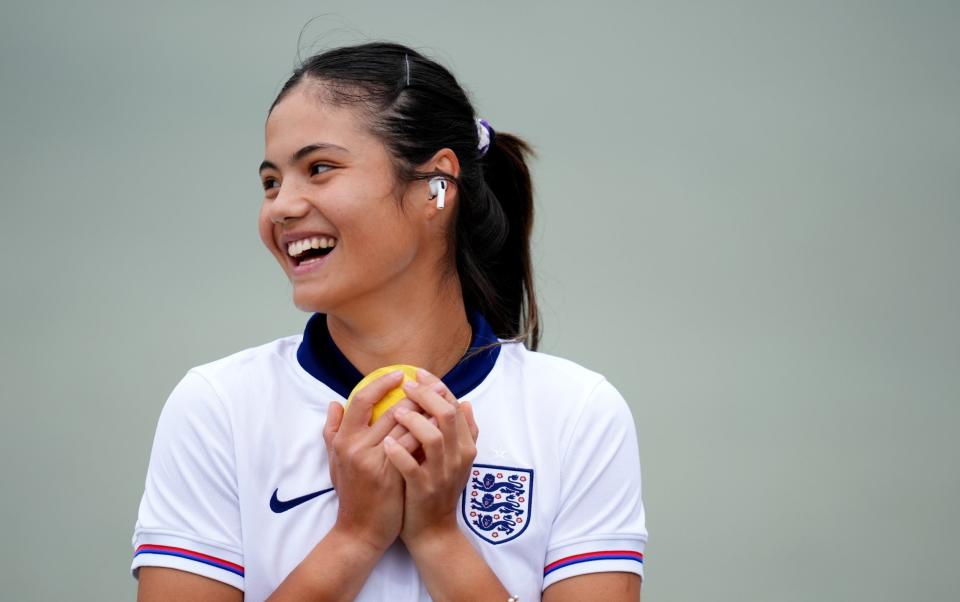 Emma Raducanu wearing a football shirt