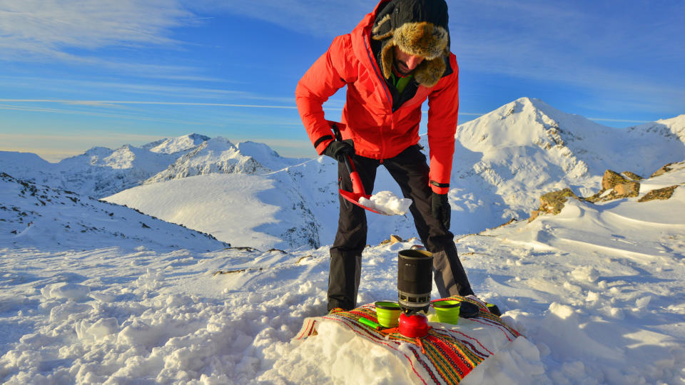 Melting snow with a camping stove