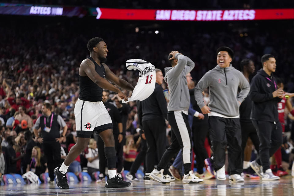 San Diego State guard Darrion Trammell (12) celebrates after defeating Florida Atlantic in a Final Four college basketball game in the NCAA Tournament on Saturday, April 1, 2023, in Houston. (AP Photo/David J. Phillip)